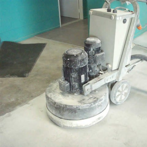 Grinding a floor in preparation for tiles