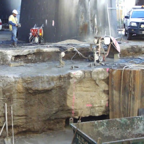 Concrete foundations being cut out by a wire saw